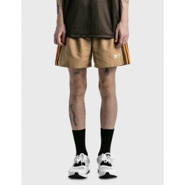 アディダス オリジナルス ショーツ ハーフパンツ 橙 オレンジ メンズ 【 ORANGE ADIDAS ORIGINALS X HUMAN MADE CONSORTIUM WIND SHORTS MULITCOLOR 】