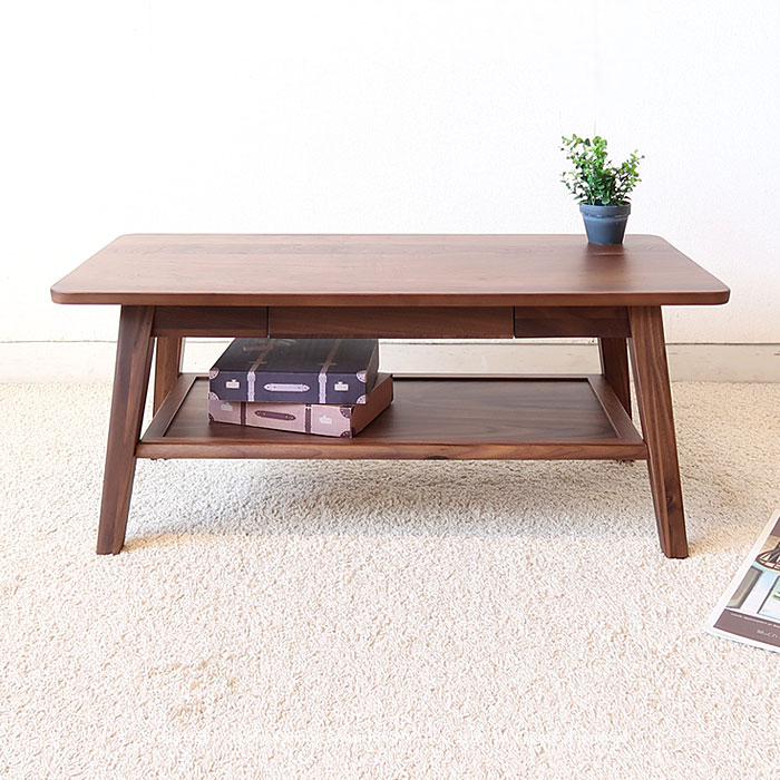 引き出し＆棚付きローテーブル ウォールナット材を使用した棚板付きのローテーブル。 あえて節やシミの入っている素材を使用しているので、木目や色が一つ一つ異なり、「木」本来のナチュラルな風合いを感じて頂けます。 天板下に引き出し収納を設けている...