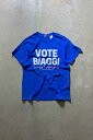 yÁzGILDAN (M_) S/S ALESSANDRA BIAGGI VOTE PRINT T-SHIRT  vg eB[Vc BLUE [SIZE: L USED]