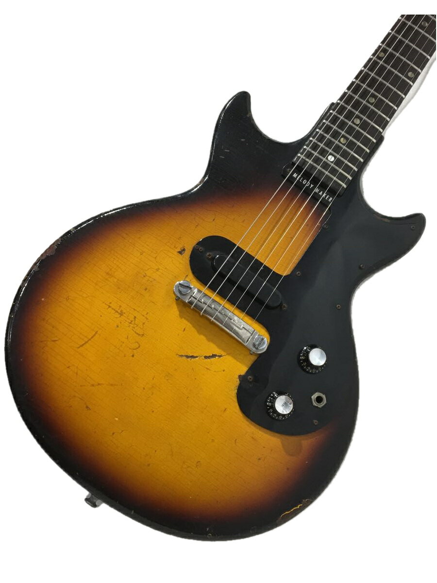 【ブランド】Gibson【ブランドカナ】ギブソン【型番】【程度】B【カラー】茶系【キーワード】　　2023/09/12セカンドストリート楽器館下北沢店 【3877】【中古】Gibson◆Melody Maker/メロディメーカー/社外ギグケース付ブランドGibson型番カラー茶系実寸【エレキギター】 スケール：628 / ナット幅：43.2 / フレット数：22 【その他】 その他サイズ：/商品は　セカンドストリート楽器館下北沢店の店頭にて販売しております。商品に関するお問合わせは、お電話(TEL:03-5431-5156)にて、問合わせ番号：2338770109516をお伝えください。配送方法やお支払い方法に関するお問い合わせは、サポートセンターまでご連絡をお願いします。※お電話の対応は営業時間内のみとなります。お問い合わせフォームでお問い合わせの際はご注文番号をご記入下さいこの商品に関する出品店舗からのコメント●1959〜71年までラインナップされたGibsonのスチューデントモデル。ダブルカット、グラマラスボディの2ndバージョンの1PUモデル。Gibsonでは珍しいシングルコイルPUが独特なサウンドを奏でます。ウェザーチェックがビッシリ入った貫禄抜群の1本！※ペグ交換(GOTHOロトマチック)、ポジションマーク2ヶ所補修、ナット交換有り●Body:Mahogany●Neck:Mahogany●FB:Rosewood / 22F●Scale:628mm●Weight:3.08kg●P.U:Gibson Single-Coil x1●社外ギグケース(VanZandt製)