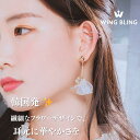 wingbling 優雅に揺れる、花びらの輝き 耳元に咲く、繊細なレジンフラワー 光を受けて輝く、スワロフスキーの煌めき ハンドメイドの温もりが伝わる一品 WING BLING