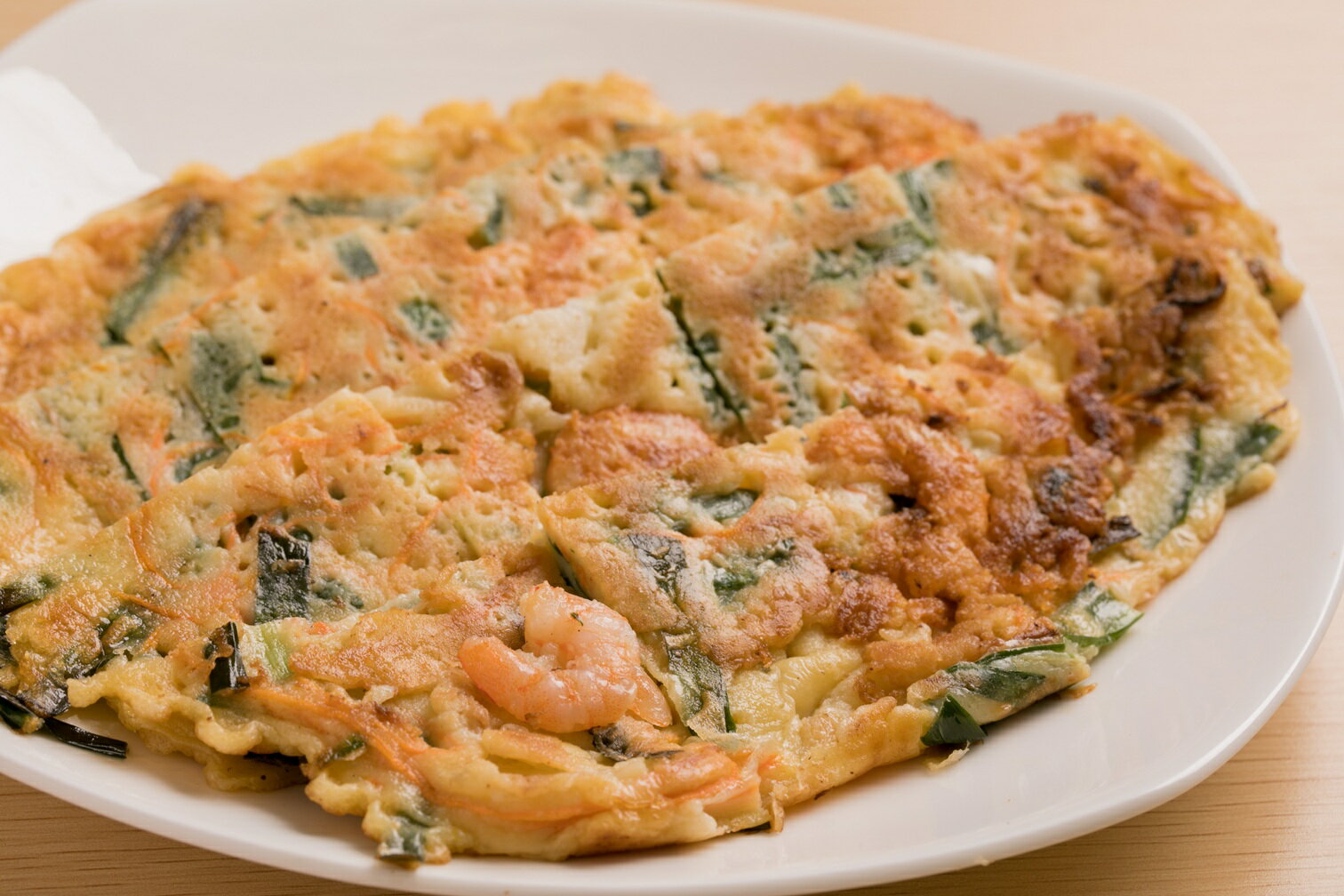 エビチヂミ（1枚）1枚1枚丁寧に焼き上げた本格チヂミです。香ばしい海老が入っており、そのままでもポン酢を付けても美味しくお召し上がりいただけます【韓国 定番 本...