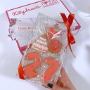 オーダーメイド アイシングクッキー 誕生日5枚セット 数字2枚 ケーキ ハート バラ クリアボックスラッピング付き リボン掛けにて発送いたします。 ご希望の色味・ケーキ型クッキーの文字をご選択ください。 ご希望の数字・ハート型クッキーの文字をオプション欄へご入力ください。 ※文字の色やドットの色などの細かいデザインはご指定いただけません。 クッキーのサイズ目安 数字：約8cm×5cm　ケーキ型：約6cm×6cm　ハート型：約5cm×5cm クリアボックスのサイズ 縦：20cm　横：12cm　高さ：2.5cm 名称 焼菓子 原材料 小麦粉（国内製造）、砂糖（グラニュ糖、オリゴ糖）、バター、卵、アーモンドパウダー、レモンジュース（レモン／香料）、乾燥卵白／着色料、（一部に小麦・乳成分・卵を含む） ※本品製造工場ではえび・かに・くるみ・ピーナッツを含む製品を生産しています（特定原材料7品目中） 内容量5枚 賞味期限ラベルに記載，製造より3週間 保存方法高温多湿を避けて冷暗所で保存 販売者大阪府大阪市中央区玉造1-2-34 Kitty Sweets 【ご購入に際してのお願い】 当店は受注生産を行っており、ご注文・決済完了後に商品の製作に入ります。決済方法を前払い（コンビニ決済・銀行振込）をご利用の場合、ご入金のタイミングによってはご希望のお届け日にてご対応致しかねます。予めご了承くださいませ。 ※手作りのため1枚1枚仕上がりが異なります。 ※完成品をSNSにアップさせていただく場合がございます。（ご購入者様のお名前は出ません） ※万が一の配送遅延を考慮して、お届け日は余裕を持ってご指定ください。