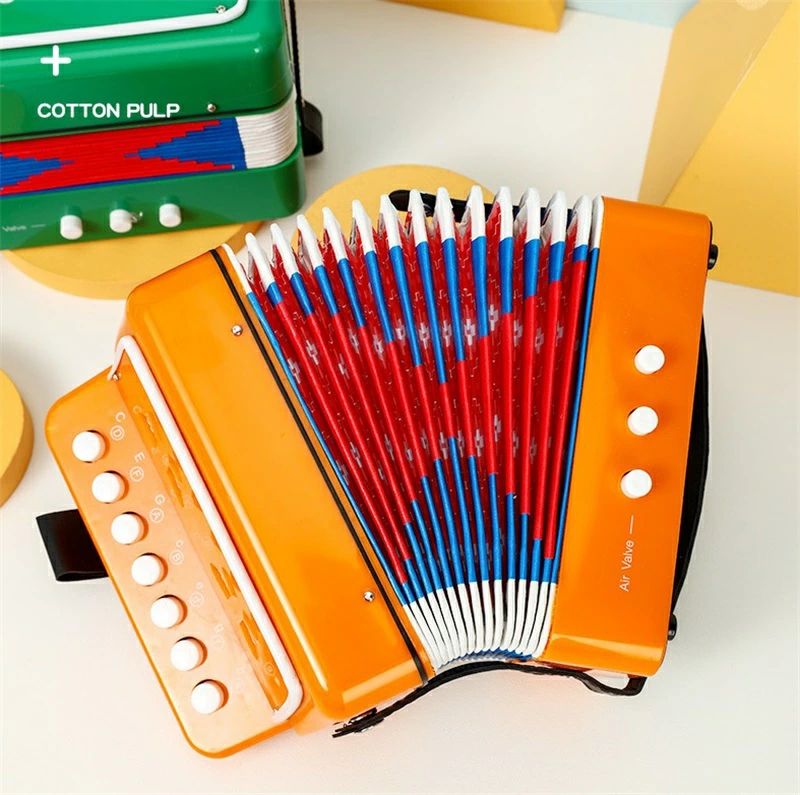 2つの低音ボタンと1つのエアーバルブ、および7つボタンのデザイン。高品質なエコ素材で作られています。子供にとってちょうどいいサイズです。子供の音楽的才能を育て、リズム感を向上させます。使いやすく、保管しやすいです。ミニ アコーディオン 児童キーボード ブルー ピンク ホワイト レッド オレンジ グリーン ローズピンク パープル