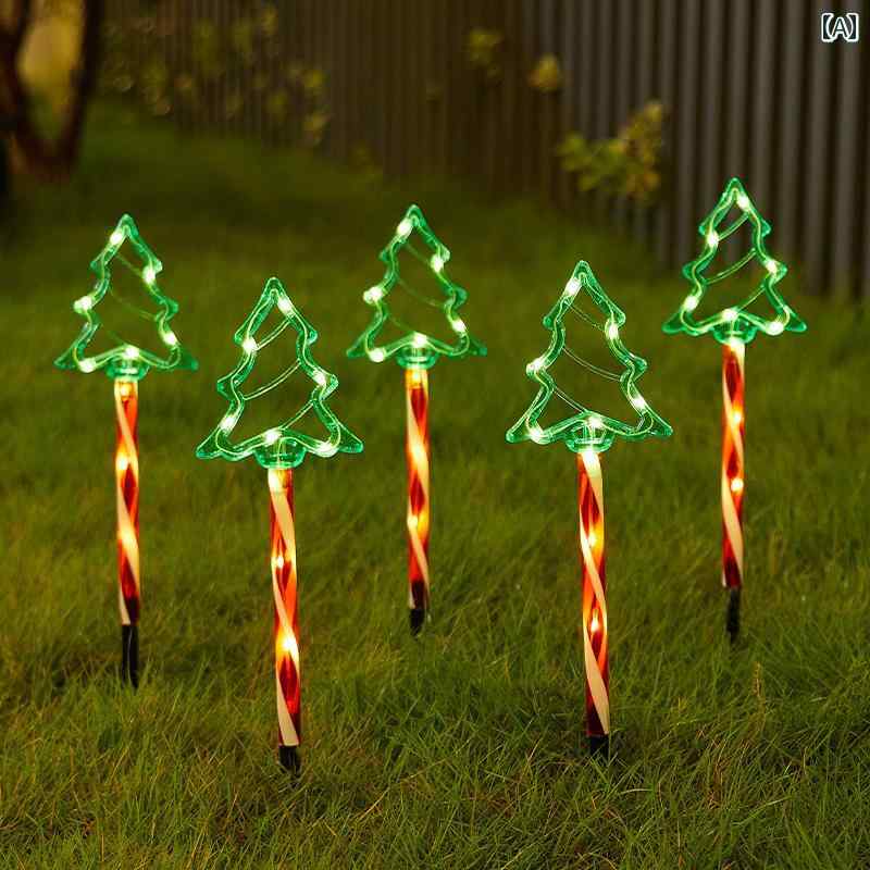 クリスマスの飾り クリスマス ツリーの 弓 クリスマスの 鹿 サンタクロースの 地面の 光の シーンの 雰..