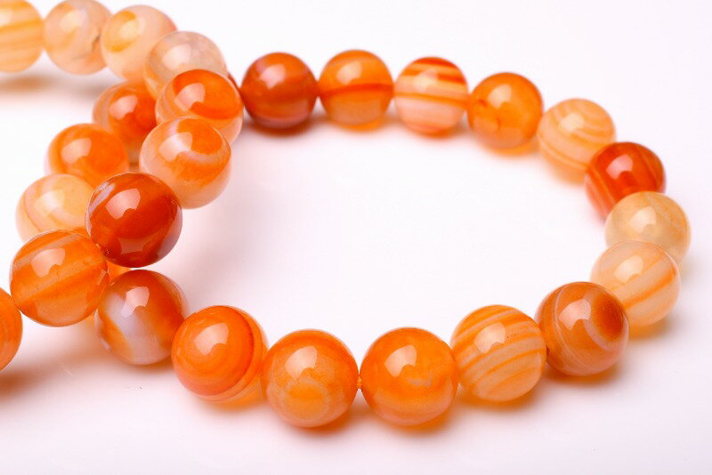 材質赤天眼石 10mmサイズ約10mm（±0.5mm）腕周り約15.5cm(伸縮性有り)重さ約27g特徴・意味赤い色の、目の様な模様の瑪瑙です。お守りにオススメです。※すべての粒に目が出ているわけではありません。天眼石（Eye Agate）...