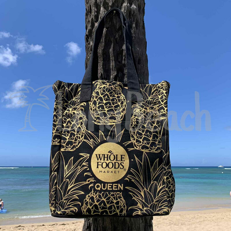 『2023年4月再入荷！』WHOLE FOODS MARKET ホールフーズマーケット ヘビートートバッグ【ハワイ限定】パイナップル柄 ブラックxゴールド / オーガニックコットン HAWAII ハワイ大きめ 便利な外ポケット付き / エコバッグ【ハワイ直輸入】【正規品】のサムネイル