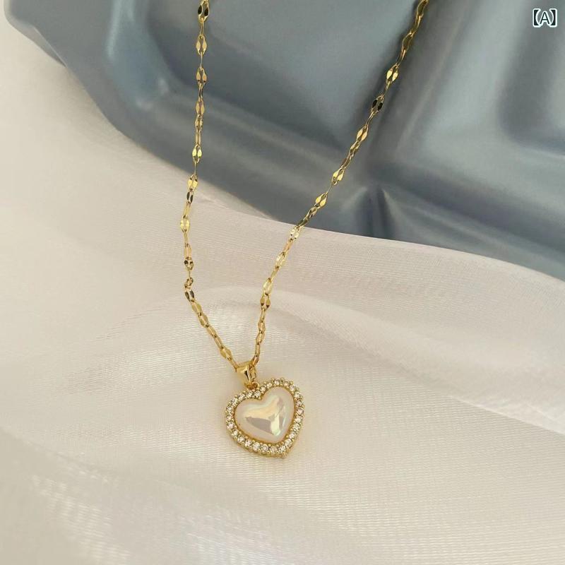 ネックレス 女性用 韓国風 ハート シェル ビーズ チタン 鎖骨チェーン ファッション 気質 汎用 18K ゴールド 電気メッキ 混合宝石 インセット クロス デザイン 夏 シーズン 軽量 スタイリッシュ アクセサリー シルバー トーン シンプル ロング