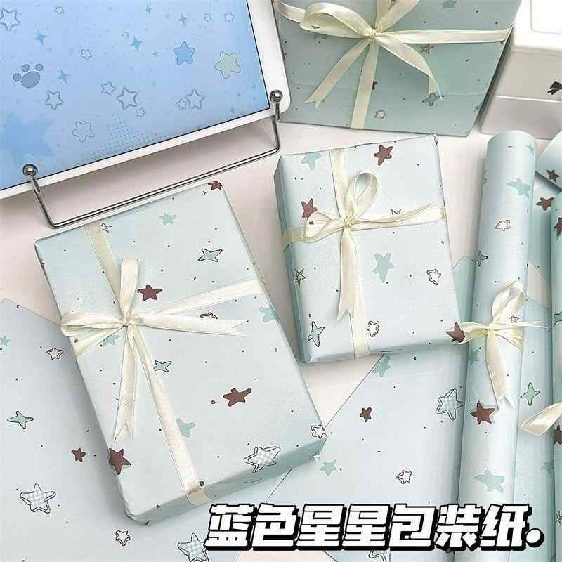 青い 星の 包装 紙の大きな シート ギフトや 装飾 キュートで スタイリッシュ リボン.カラフルカラーオ..
