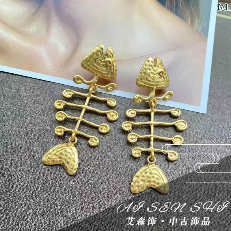 ピアス レディース ゴールド 流れる 魚の骨モチーフ 揺れる タッセル イヤリング ...
