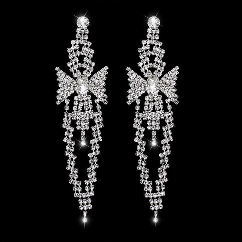 Rakuten - ロングボウタイ クリスタルウエディングジュエリーピアス 1ペア シルバー 結婚式 新婦 結婚式 披露宴 衣装 長い 揺れる ジルコニア ラインストーン レディース プレゼント 20G 20ゲージ 女性 ドレス 舞台 ブライダル プリンセス 花嫁 流麗 綺麗 おしゃれ 人気 蝶々 リボン