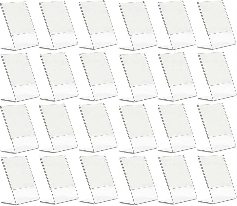 バリエーションコード : 2b6drk2284商品コード2br0p4wtp8商品名卓上 POP スタンド 販促用 サイン ホルダー アクリル 写真たて フォトフレームブランドKINOKINOカラー透明サイズ等ハガキサイズ 24個 セットサイズ　ハガキサイズ 約15cmx約10cm　傷防止用の保護フィルムを剥がしてからご使用くださいハガキサイズに対応します。メニュー表示、値札、商品説明POP、オフィスの案内表示におすすめです。見やすい角度付き設計　適度な傾斜角度により、テーブルや棚、デスクに置いても文字が読みやすく、お客様の目を引きます。手に取りやすく、情報が自然に目に入る設計です。多用途で幅広く活躍　カフェ、レストランのメニュー立て、小売店の値札ホルダー、オフィスの案内表示、イベントでの作品紹介、自宅のフォトフレームとして使用可能。まとめて24個セットだから、複数の場所で統一感のあるディスプレイが可能。店舗全体やオフィスフロア全体のブランディングにも貢献します。※ 他ネットショップでも併売しているため、ご注文後に在庫切れとなる場合があります。予めご了承ください。※ 品薄または希少等の理由により、参考価格よりも高い価格で販売されている場合があります。ご注文の際には必ず販売価格をご確認ください。※ 沖縄県、離島または一部地域の場合、別途送料の負担をお願いする場合があります。予めご了承ください。※ お使いのモニタにより写真の色が実際の商品の色と異なる場合や、イメージに差異が生じることがあります。予めご了承ください。※ 商品の詳細（カラー・数量・サイズ 等）については、ページ内の商品説明をご確認のうえ、ご注文ください。※ モバイル版・スマホ版ページでは、お使いの端末によっては一部の情報が表示されないことがあります。すべての記載情報をご確認するには、PC版ページをご覧ください。KINOKINO 卓上 POP スタンド 販促用 サイン ホルダー アクリル 写真たて フォトフレーム サイズ　ハガキサイズ 約15cmx約10cm　傷防止用の保護フィルムを剥がしてからご使用ください ハガキサイズに対応します。メニュー表示、値札、商品説明POP、オフィスの案内表示におすすめです。透明アクリル製　クリアな透明素材が、インテリアに馴染み、洗練された印象を演出。カフェ、レストラン、小売店、オフィス、イベント会場がプロフェッショナルな雰囲気になります。見やすい角度付き設計　適度な傾斜角度により、テーブルや棚、デスクに置いても文字が読みやすく、お客様の目を引きます。手に取りやすく、情報が自然に目に入る設計です。多用途で幅広く活躍　カフェ、レストランのメニュー立て、小売店の値札ホルダー、オフィスの案内表示、イベントでの作品紹介、自宅のフォトフレームとして使用可能。まとめて24個セットだから、複数の場所で統一感のあるディスプレイが可能。店舗全体やオフィスフロア全体のブランディングにも貢献します。