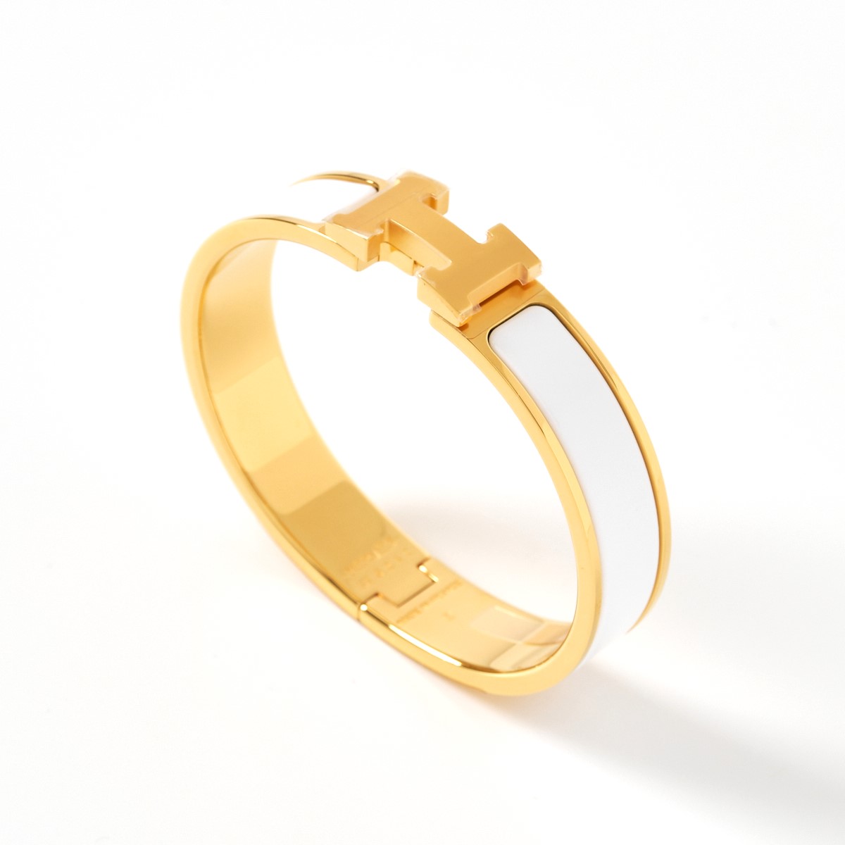 【中古】HERMES エルメス エナメルブレスレット 《クリックH》PM 700001F 31PM バングル ゴールドプレーテッド ホワイト×ゴールド アクセサリーのサムネイル