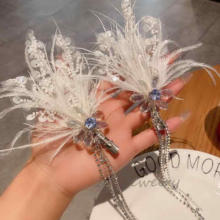 ・カテゴリ: ヘアアクセサリー・種類: ヘアクリップ・素材: 人造水晶・加工: 手作業・カラー: 水晶白色・流行要素: 羽毛・スタイル: ファッション通勤・対象: 女性