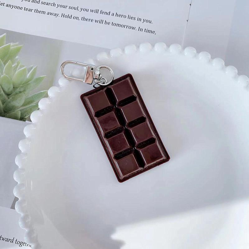・カテゴリ: キーホルダー・カラー展開: チョコレートドアバックルチャーム、チョコレートキーリング・主な素材: PVC・スタイル: モダンミニマリスト