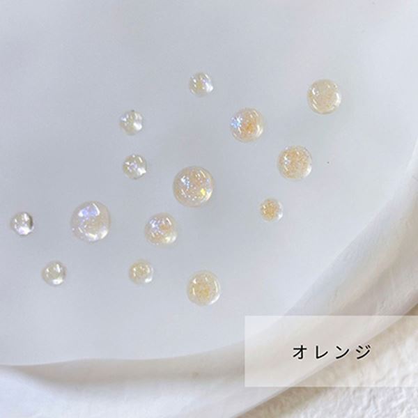 商品到着後レビューを書いて次回使える200円OFFクーポンGETオレンジ透明な水滴のように輝くグリッター入りの半球ネイルパーツ。光を受けてキラキラと輝き、指先に特別なアクセントをプラスします。3サイズアソートで使いやすさも◎。カラーはパープル、ターコイズ、クリア、オレンジの4色展開。約1g