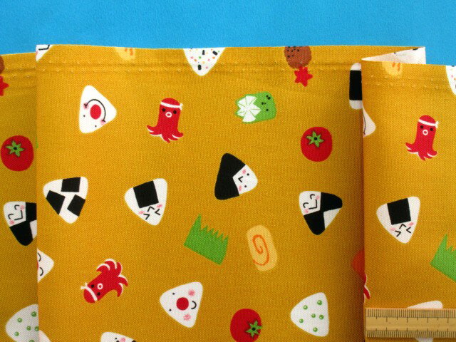 綿プリントオックス生地おにぎり・カラシ（110cm幅　1m）