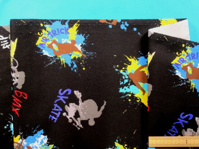 在庫処分綿プリントオックス生地BMX・黒×イエロー（110cm幅　1m）