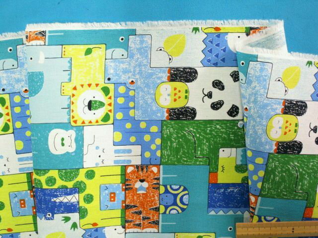 綿プリントオックス生地動物・グリン系×イエロー（110cm幅　1m）