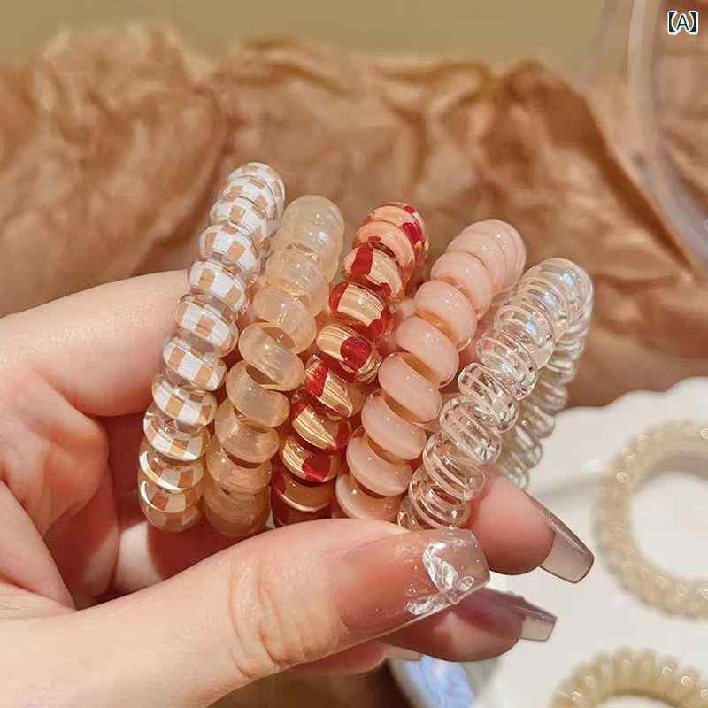 ・カテゴリ: 電話線ヘアゴム・素材: プラスチック、樹脂・加工工程: り・カラー展開: オレンジ系、ピンク系、ブラック系、イエロー系、ブルー系、グリーン系、ブラウン系・デザイン要素: 星・スタイル: ファッション通勤