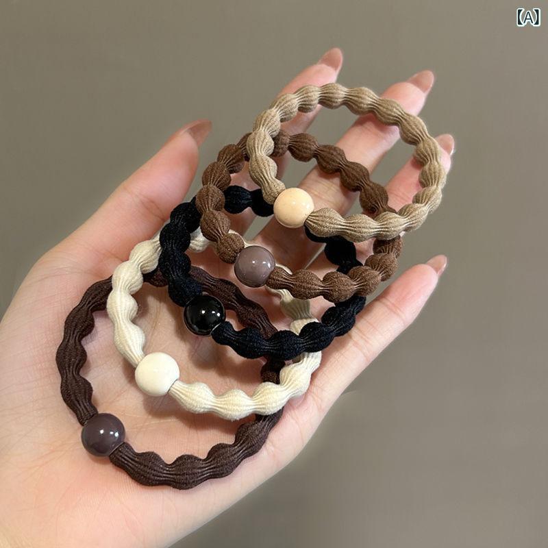 ・カテゴリ: ポニーテール用ヘアゴム・主な素材: 布・加工技術: 手工芸・カラー展開: 混色、ブラック・デザイン特徴: 球体・スタイル: ファッション通勤風・仕様: 高弾力