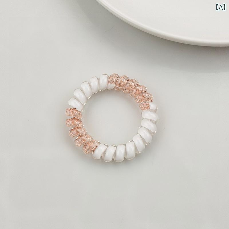 ・カテゴリ: ヘアゴム（スプリングヘアゴム）・主な素材: プラスチック、樹脂・加工技術: ハンドメイド・カラー展開: オレンジ、ブルー、ピンク、パープル、グリーン、ランダムアソート・デザイン: サークル、幾何学・スタイル: コンミュータースタイル・仕様: 高弾力