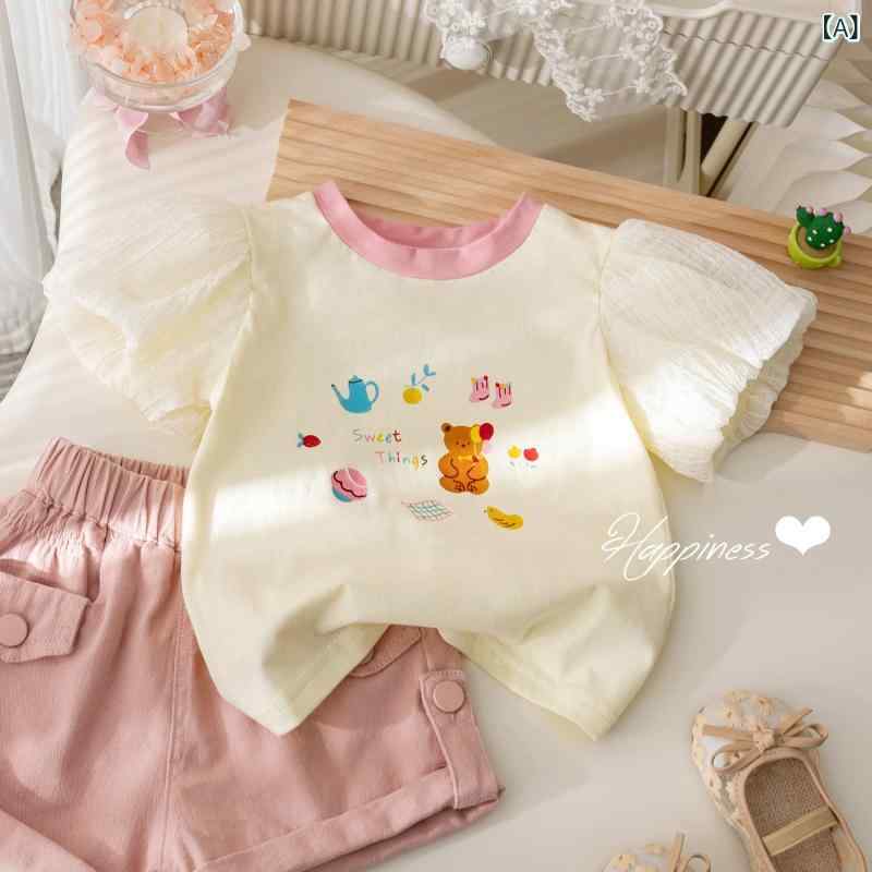 Rakuten - 女児 Tシャツ トップス 女の子 子供服 短袖 花苞袖 泡泡袖 丸首 綿 吸湿排汗 柔軟 接触冷感 夏 春夏 杏色 ホワイト かわいい 花柄 カード プリント 日常使い 通園 カジュアル