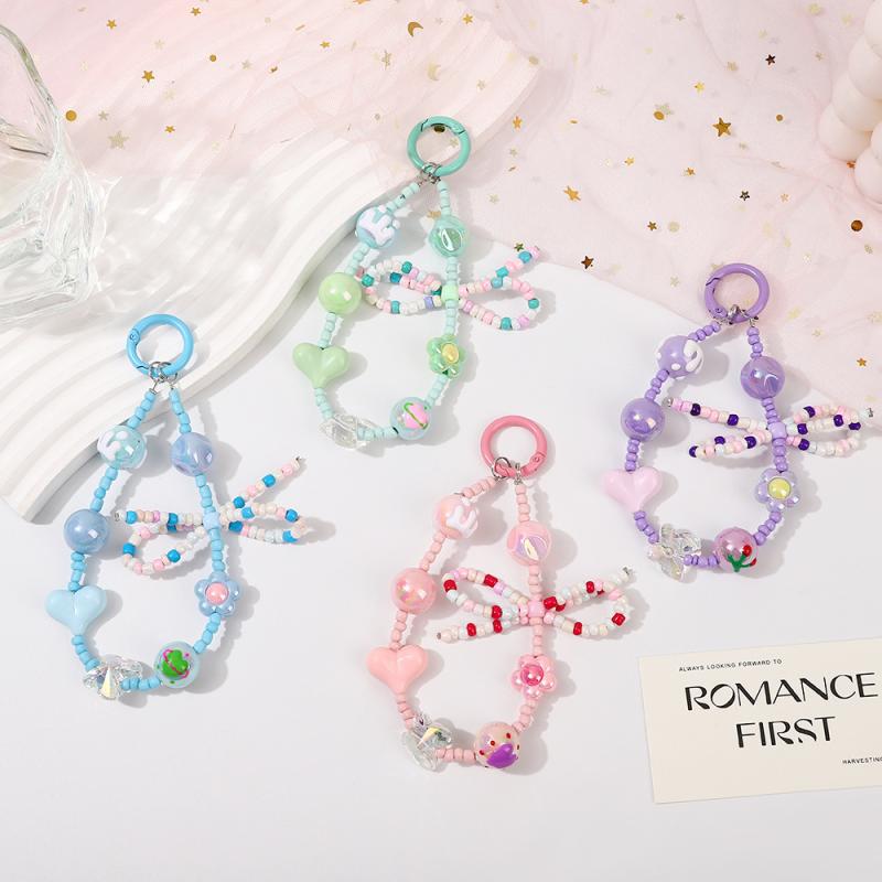 スマホストラップ レディース ビーズ リボン キャンディーカラー アクリル 水晶 キ...