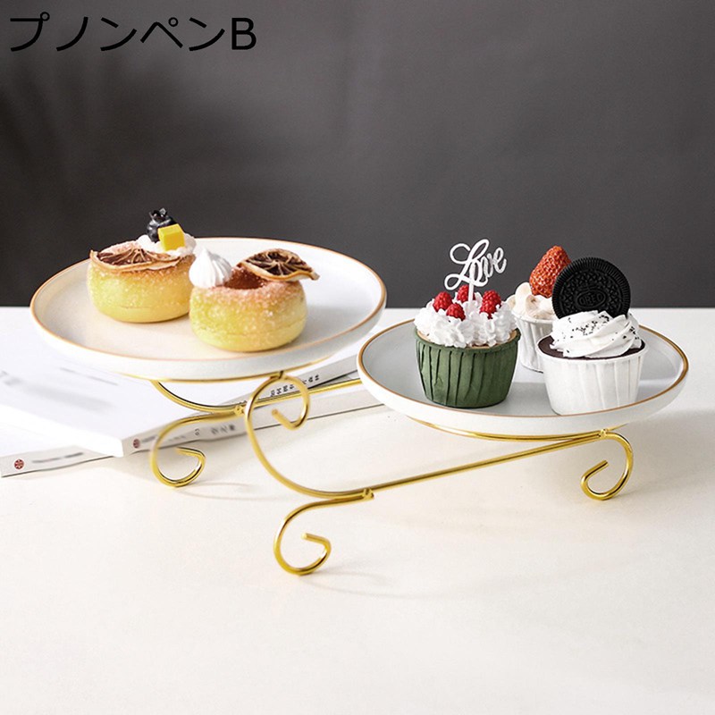 　　　 ◆◇◆人気の秘密◆◇◆ クリエイティブな陶磁器の果物皿。 【おすすめ】組み立てが簡単で使用しないときはコンパクトに収納可能！テーブルやカウンターに置いてあるだけで、おしゃれな雰囲気へ。汚れも落としやすい加工の木製素材。 表面は滑らかで、汚れやホコリに強いです。水で洗って軽く濡らしたタオルで汚れを拭き取れる、手入れが簡単で、片付けが楽になる。フルーツ、ケーキ、デザートプレートだけでなく、スイートホームのエレガントな装飾もできます。審美的なデザインで、ダイニングルームやテーブルの装飾に最適です。パーティーギフトに最適です。 【欧風のホームパーティーを楽しむ 】 英国で親しまれているアフタヌーンティーの文化をホームパーティーで楽しみましょう。ゲストを呼んでケーキスタンドに置いた食事を囲めば、気分の上がるおしゃれなブリティッシュスタイルに様変わりです また、プレートどうしの幅にも余裕があるので 【幅広い用途】果物、ケーキ、美味しい家庭料理、デザート、スナック、ケーキ作りから役立ちますなど。ケーキスタンド，テーブルで使う以外にも、撮影用・調味料やアクセサリースタンドとしてもお使いいただけます。 　　　◆◇◆注意事項◆◇◆ご覧のモニターの環境、撮影環境により実物と色味が異なって見える場合がございます。湿った状態で他のものと擦り合わせると色が移る恐れがあります。濃色品の洗濯時は、白色、淡色と分けて洗ってください。説明 ようこそいらっしゃいませ ??ケーキスタンドは主に優れたセラミックス素材で作られており、強くて耐久性があります。 ?美しいケーキスタンドは、特別な視覚的な楽しみでお客様を感動させるために食べ物のプレートを見せます。それは優雅に見え、テーブルかパーティーを飾ることができます。 ??ケーキをのせるだけで上品でおしゃれに演出。普段使いからホームパーティーまで幅広く使えます。 ?果物、野菜、デザート、パン、お菓子、スナックなどを置くのに使用できます。リング、ネックレス、イヤリングなどのアクセサリーのカウンター 表示に使用できます。 [注意] ??初めて使用する前に、水または洗剤でプレートの表面を洗うことを勧めします。 ??手作業による測定のため、わずかな誤差が生じる場合がありますが、製品の使用に影響はありません。ご質問がありましたら、いつでもメールでお問い合わせください。