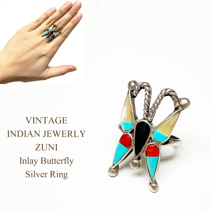 ヴィンテージ インディアンジュエリー ズニ族 インレイ バタフライ シルバー リングVINTAGE INDIAN JEWELRY ZUNI Inlay Butterfly Silver Ring ◆輸入品販売に関しまして諸注意◆ ※新品、未使用品となりますが 購入先による背中付近に防犯タグのピン穴 　　　　形を整えるための針孔がございます。 　　　　いずれもお洗濯して頂くと消えますが、 　　　　不良品ではございません。 　　　　他、多少のしわや紙タグに欠損がある場合がございます。 ご理解の上、ご検討をお願い致します。 お気になる方は一度お問い合わせの上、ご確認ください。楽天システム変更の為、現在沖縄離島への宅配便送料無料での配送を見合わせております。 詳しくはこちら『宅配便』をご確認ください。 ◆商品説明◆ アメリカ、ニューメキシコからヴィンテージジュエリーの入荷です。 ズニ族、モザイク＆チャンネルインレイのバタフライモチーフのリング。 ターコイズ、オニキス、コーラル、ゴールドリップシェルが 丁寧に組み合わされ製作されいます。 モチーフのバタフライは、姿を変え成長していく様から人生に例えられたり 変形や変貌、変化を表し「生命力の象徴」とされています。 時を経たヴィンテージジュエリーの醍醐味溢れる大変魅力的なリングです。 年齢を問わずご愛用いただけるアイテムです。 贈り物にも♪ ◆インディアンジュエリー◆アリゾナ、ニューメキシコ等、インディアン達の一点一点、細かい工程を経てつくられるハンドメイドならではの貴重で魅力あふれるアクセサリー♪RALPH LAURENでも取り扱われている等、各方面からの人気も高く熱狂的なファンの多いアイテムです♪そんな中から当店ならではの厳選した数々のアクセサリーをお届けいたしております♪ 素材 TURQUOISE,ONYX,CORAL,GOLD LIP SHELL, SILVER サイズ 日本相当サイズ 台座最大全長/div> 台座最大幅 14号相当 3 2 ※単位はすべてcmになります。 OTHER ITEM 注記 ※できるだけ忠実に再現するよう努力しておりますが、 ディスプレイ画面等の環境上、ページで見た色と実際の商品の色とは 多少違う場合がございます。ご不明な点はお問い合わせください。 ※サイズは平置きで計測しています。 慎重に計測しておりますが、商品によって多少の誤差が出てしまう場合がございますのでその旨ご了承くださいませ。