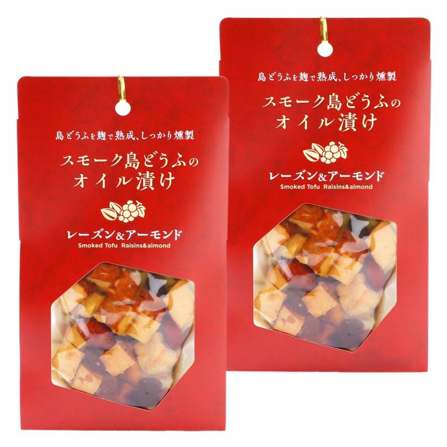 【商品特徴】スモーク島どうふを、レーズン、アーモンドと一緒にオリーブオイルに漬け込んで、さらに香ばしくまろやかに仕上げました。 レーズンのほんのりとした甘さやスモークのフレーバーが、赤ワインやハイボールとよく合います。 そのまま召し上がるのはもちろん、サラダやクラッカーのトッピングやバケットにのせてブルスケッタ風にしてもGOOD！ いろんな楽しみができるのもうれしいポイントです。 商品説明メーカー所在地 原材料 豆腐(沖縄県製造)、オリーブオイル、レーズン、アーモンド、味噌、米麹、米、砂糖、昆布エキス/豆腐用凝固剤、(一部に大豆・アーモンドを含む) サイズ 204×120×50(mm) 原産国 日本 内容量 100g×2 アレルギー表示 大豆、アーモンド 温度帯 常温 メーカー名 株式会社食のかけはしカンパニー沖縄県うるま市勝連南風原5192-27