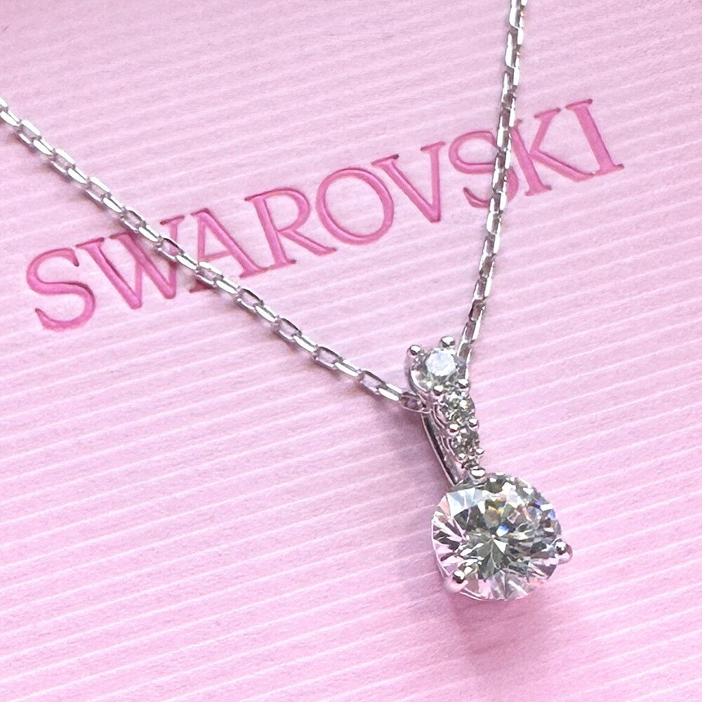 Swarovski necklace for women, simple and elegant, with silver and white crystal pendant. Comes with genuine shopping bag. A perfect gift for women, girlfriends, wives, mothers, and for special occasions such as coming of age, graduation, or entrance ceremony.