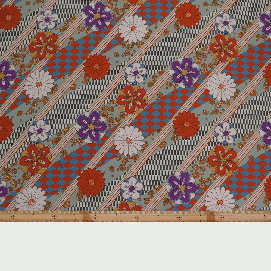 ポリちりめん生地 斜め市松に花(浅緑) 10cm単位 切り売り