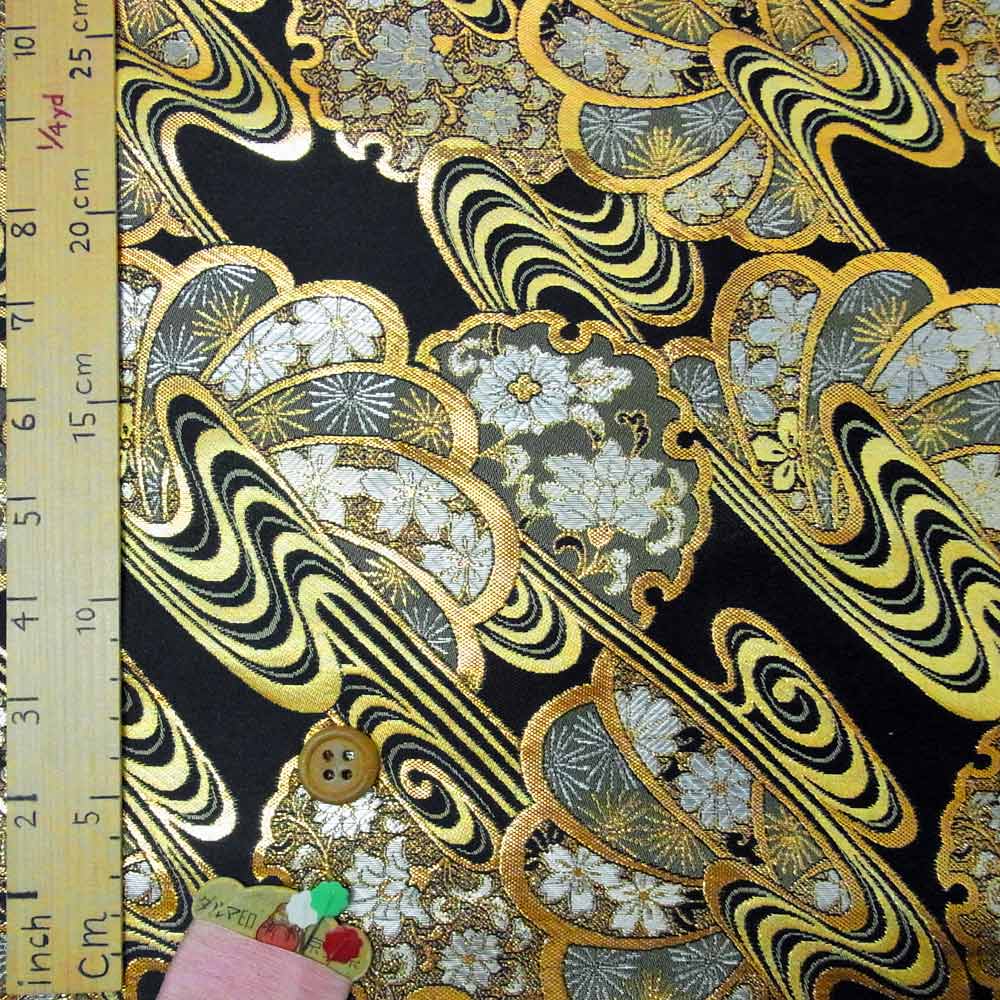 金襴生地(金らん)流水に雪輪とねじり花(黒) 10cm単位 切り売り