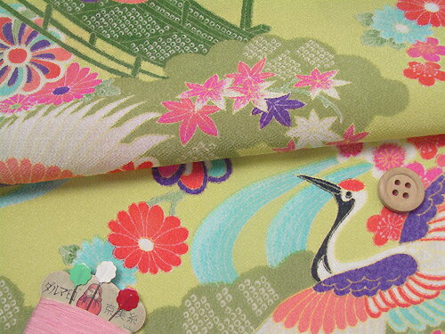 一越ちりめん・貝桶に鶴(ひわ色) 10cm単位 切り売り