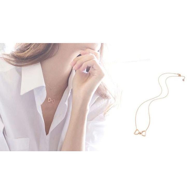 ニャンワークショップのネックレス ペンダント レディース 女性 婦人用 リボンモチーフ ラインストーン ビジュー アクセサリー かわいい キュート ゴールドカラー シルバー｜アングル3