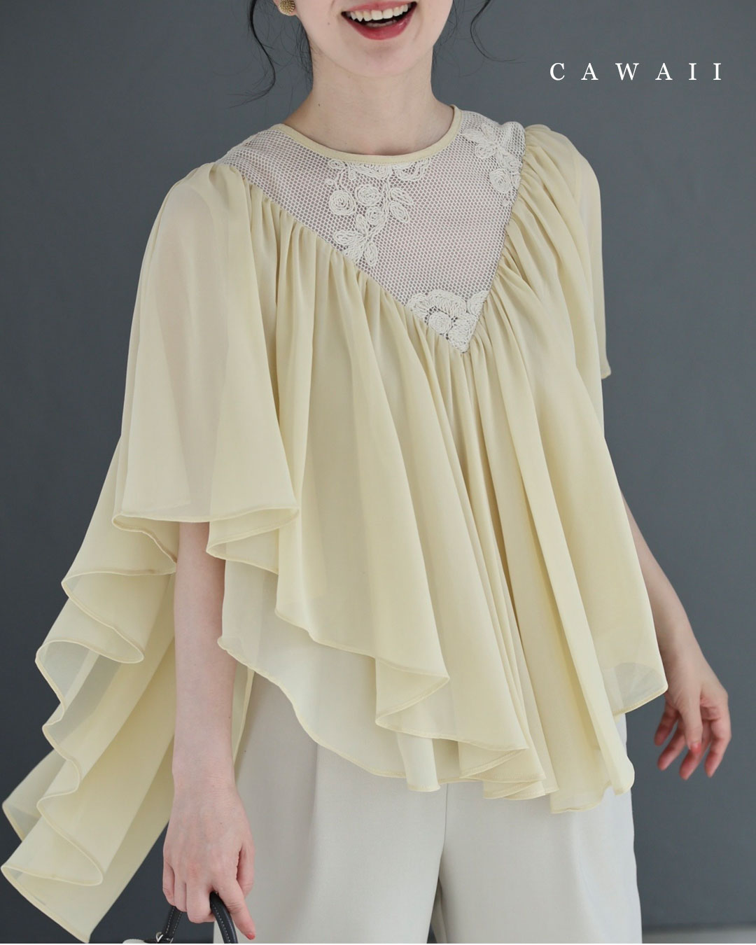 (S-2L size) A loose, flowing flared blouse top with floral embroidery that floats across the décolletage.