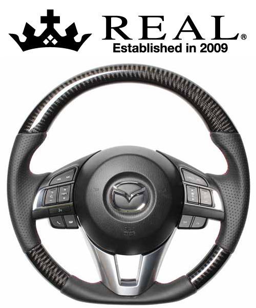 REAL STEERING オリジナルシリーズ マツダ アクセラ 前期 BM/BY系用 カラー：ブラックカーボン(レッド×ブラックユーロステッチ) (MZA-BKC-RD)【ハンドル】【自動車パーツ】レアル ステアリング