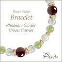 Rhodolite Garnet / Green Garnetロードライトガーネット・グリーンガーネット レディース誕生石ブレスレットパスクルでは、たくさんの種類のストーンを使用して、様々なデザインブレスレットを作成しています。天然石は流通している種類だけでも数百種類ですので、それらを組み合わせたデザインのバリエーションは無限大です。こちらは、細身の女性らしいデザインに、ロードライトガーネットをメインストーンとして、そしてサブストーンにグリーンガーネットを組み合わせました。※Pascleでは素材の品質にもこだわって製作しております。Rhodolite Garnetロードライトガーネットロードライトガーネット（和名：薔薇石・薔薇柘榴石/ばらいし・ばらざくろいし）は、1月の誕生石ガーネットの一種で、紫色を帯びた赤色が特徴です。「パイロープ」、「アルマンディン」という赤色系の2種類のガーネットの中間の成分をもっています。透明度が高く、光に透けて赤紫色に輝くさまが上品で美しい石です。粒サイズ：8mm(±0.5mm)穴サイズ：0.8mm以上産地：ブラジル品質：表面にガーネット特有のクラックが見られる場合がございます。Green Garnetグリーンガーネットグリーンガーネット(和名：石榴石/ざくろいし)は、ガーネットの中でも希少性が高く、宝石としても高く評価されています。当店では、均一に優しいグリーンカラーが見られるもので、内包物（黒い濁り等）がほとんど見られない粒を厳選しております。クォーツ系など透明感のあるストーンと色合いの相性が良いです。本水晶はもちろん、アメジスト、シトリン、ローズクォーツなどとの組み合わせがおすすめです。粒サイズ：6mm(±0.5mm)穴サイズ：0.8mm以上品質：表面にガーネット特有のクラックが見られる場合がございます。Rainbow Quartzレインボークォーツレインボークォーツは、シャボン玉のような美しい輝きを持ったパワーストーンです。アクアオーラと同様に水晶を特殊な工程で加工して作られており、長くこの美しさが保たれます。他のクォーツ系など透明感のあるストーンと色合いの相性が良いです。本水晶はもちろん、アメジスト、フローライト、他のオーラ形ストーンなどとの組み合わせがおすすめです。粒サイズ：6mm(±0.5mm)穴サイズ：0.8mm以上産地：ブラジル(加工アメリカ)品質：写真のように、全粒にオーラ模様が見られます。Mother of Pearlマザーオブパールマザーオブパール（和名：真珠母貝/しんじゅぼかい）は、オフホワイトが可愛らしく、定番人気のパワーストーンです。当店では、ツヤ感があり、凹凸のほとんど見られない高品質なマザーオブパールを厳選してご用意しております。定番人気のカラーですので、水晶やパールを始め、ラベンダーアメジスト、ローズクォーツなど様々なカラーストーンと組み合わせられます。特に優しい色合いのストーンとの組み合わせがおすすめです。粒サイズ：6mm(±0.5mm)穴サイズ：0.8mm以上品質：粒ごとに写真のような貝殻模様が見られます。Size選べるサイズバリエーションSサイズ　内周14cm〜14.5cmMサイズ　内周15cm〜15.5cmLサイズ　内周16cm〜16.5cmLLサイズ　内周17cm〜17.5cmサイズにより、石の配置・数量が異なります。 なるべく現物に近いカラーで撮影するように心がけておりますが、ご利用の端末、ディスプレイによって実物と若干異なる場合がありますので、予めご了承ください。腕のサイズの測り方はこちらcomponent使用しているパワーストーンロードライトガーネット 8mmグリーンガーネット 6mmレインボークォーツ 6mmマザーオブパール 6mmHandmade1品1品、心を込めたハンドメイドパスクルのアクセサリーは、ご注文をいただいてからスタッフが、一つずつ心を込めてお作りしております。午前中までのご注文は、当日制作し、発送いたします。「子どものために●cmでつくってほしい」「この石を●●に差し替えてほしい」など、どのようなご要望でもできる限り対応いたします。Rubber String選べるゴム紐の種類アンタロンゴム（標準仕様）当店のブレスレットは、全品こちらの「アンタロンゴム（伸縮性あり）」を使用しております。耐久性も高く、透明の紐なので高級感があり石の美しさを引き立てます。オペロンゴム（オプション：無料）こちらは繊維状になったタイプの「オペロンゴム（伸縮性あり）」です。商品にあわせて2重、または4重で結びますので、いきなり切れてしまう心配はありません。BOX Wrappingジュエリーボックスジュエリーボックス、ショッピングバッグ（紙袋）ブレスレット専用のジュエリーボックスに入れて、リボン（ホワイト）を掛けた状態でお届けいたします。1注文ごとに、ショッピングバッグ1枚お届けいたします。※ショッピングバッグが付属する商品を2個以上のご注文の場合、通常の付属枚数は1枚です。2枚以上ご入用の場合は、備考欄にご記載ください。大切な人への特別な贈り物に。天然石のチャームがつく特別なラッピングでお届けします。※使用する石やサイズはランダムです。チャームは販売商品ではございません。料金：800円（税込）カラー・ホワイト×ピンクベージュ・ブラウン×ゴールドgreetingcard想いを伝えるグリーティングカード封筒入りのグリーティングカードをご用意しています。大切な人への贈りものに、メッセージを添えませんか？料金：350円（税込）カラー：ホワイト／ブラウン※イベントシーズンには限定カードもお選びいただけます※メッセージの印字も可能です（最大15字×5行）ご希望の場合はカートページの備考欄にご入力ください。Guarantee充実の保証パスクルはパワーストーンの通販専門ショップです。お客様に安心してご提供するために、充実した保証を提供いたします。30日間メンテナンス無料こちらの商品は到着から30日間のメンテナンス（サイズ調整・修理）を無料で承っております。（メンテナンスサービスのご利用にはパスクル会員登録が必要です。）「サイズを調整したい」「一部の石を交換したい」「ゴムが切れてしまった」どうぞお気軽にご相談ください。※追加ストーンの代金や往復に必要な送料は、お客様のご負担になります。※到着から30日以降も有償にてメンテナンス承ります。返品・交換対応いたします商品到着後、1週間以内にご連絡ください。返品・交換を承ります。以下は返品対象外となりますのでご注意ください。・お届けから8日以上が経過した商品・タグを切り取られた商品