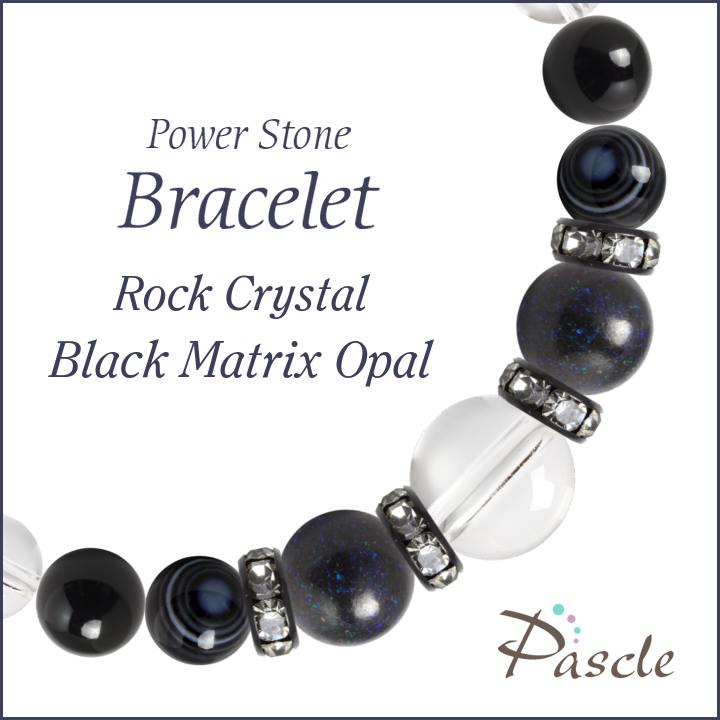 Black Matrix Opal / Black Onyxブラックマトリックスオパール・ブラックオニキス　メンズクリスタルブレスレットパスクルでは、たくさんの種類のストーンを使用して、様々なデザインブレスレットを作成しています。天然石は流通している種類だけでも数百種類ですので、それらを組み合わせたデザインのバリエーションは無限大です。こちらは、大粒のクリスタルをベースにして、ブラックマトリックスオパールとブラックオニキスを組み合わせたデザイン。※Pascleでは素材の品質にもこだわって製作しております。Rock Crystalクリスタル（本水晶）クリスタル（和名：本水晶/ほんすいしょう）は、4月の誕生石で、パワーストーンの中でも最も人気です。当店は「天然」のブラジル産本水晶に拘っており、クラックなどはなく、ツヤ感もあるとても上質な水晶をご用意しております。水晶は、どんなパワーストーンと組み合わせても大丈夫な万能ストーンです。カラーストーンと組み合わせても高級感のあるブレスレットに仕上がりますよ。粒サイズ：12mm(±0.5mm)穴サイズ：0.8mm以上産地：ブラジル品質：写真のとおり、透明感抜群で、傷などもありません。Black Matrix Opalブラックマトリックスオパールブラックマトリックスオパール（和名：蛋白石/たんぱくせき）は、オパール特有の遊色効果（虹色の輝き）が美しい希少なストーンです。そもそも市場での流通量が少ない天然石ですが、当店では濁りが少なく、輝きの美しい高品質なマトリックスオパールをご用意しております。粒サイズ：10mm(±0.5mm)穴サイズ：0.8mm以上産地：オーストラリア品質：遊色効果（キラキラとした輝き）の色・量は粒ごとに異なります。Black Onyxブラックオニキスブラックオニキス（和名：黒瑪瑙/くろめのう）は、数あるブラックカラーストーンの中でも、最も定番です。当店では、ツヤ感のよい美しいオニキスをご用意しております。オニキスは、数あるブラックカラーのパワーストーンの中でも代表的な存在です。黒色や落ち着いた色合いがお好きな方に重宝されています。粒サイズ：8mm(±0.5mm)穴サイズ：0.8mm以上品質：色むら等の個体差はほとんどありません。Eye Agate天眼石天眼石（別名：チベットアゲート）は、角度によって目玉のように見える。白い縞模様が特徴です。当店では上質な天眼石をご用意しておりますので、縞模様が各粒にしっかりと見られます。お守り系のストーンと組み合わせて、厄除けなどのお守りアイテムを作るのに人気です。粒サイズ：8mm(±0.5mm)穴サイズ：0.8mm以上産地：チベット品質：粒ごとに縞模様が異なります。Size選べるサイズバリエーションSサイズ　内周15cm〜15.5cmMサイズ　内周16cm〜16.5cmLサイズ　内周17cm〜17.5cmLLサイズ　内周18cm〜18.5cm3Lサイズ　内周19cm〜19.5cm4Lサイズ　内周20cm〜20.5cmサイズにより、石の配置・数量が異なります。 なるべく現物に近いカラーで撮影するように心がけておりますが、ご利用の端末、ディスプレイによって実物と若干異なる場合がありますので、予めご了承ください。腕のサイズの測り方はこちらcomponent使用しているパワーストーンクリスタル（本水晶） 12mmブラックマトリックスオパール 10mmブラックオニキス 8mm天眼石 8mmクリスタル（本水晶） 8mmHandmade1品1品、心を込めたハンドメイドパスクルのアクセサリーは、ご注文をいただいてからスタッフが、一つずつ心を込めてお作りしております。午前中までのご注文は、当日制作し、発送いたします。「子どものために●cmでつくってほしい」「この石を●●に差し替えてほしい」など、どのようなご要望でもできる限り対応いたします。Rubber String選べるゴム紐の種類アンタロンゴム（標準仕様）当店のブレスレットは、全品こちらの「アンタロンゴム（伸縮性あり）」を使用しております。耐久性も高く、透明の紐なので高級感があり石の美しさを引き立てます。オペロンゴム（オプション：無料）こちらは繊維状になったタイプの「オペロンゴム（伸縮性あり）」です。商品にあわせて2重、または4重で結びますので、いきなり切れてしまう心配はありません。BOX Wrappingジュエリーボックスジュエリーボックス、ショッピングバッグ（紙袋）ブレスレット専用のジュエリーボックスに入れて、リボン（ホワイト）を掛けた状態でお届けいたします。1注文ごとに、ショッピングバッグ1枚お届けいたします。※ショッピングバッグが付属する商品を2個以上のご注文の場合、通常の付属枚数は1枚です。2枚以上ご入用の場合は、備考欄にご記載ください。大切な人への特別な贈り物に。天然石のチャームがつく特別なラッピングでお届けします。※使用する石やサイズはランダムです。チャームは販売商品ではございません。料金：800円（税込）カラー・ホワイト×ピンクベージュ・ブラウン×ゴールドgreetingcard想いを伝えるグリーティングカード封筒入りのグリーティングカードをご用意しています。大切な人への贈りものに、メッセージを添えませんか？料金：350円（税込）カラー：ホワイト／ブラウン※イベントシーズンには限定カードもお選びいただけます※メッセージの印字も可能です（最大15字×5行）ご希望の場合はカートページの備考欄にご入力ください。Guarantee充実の保証パスクルはパワーストーンの通販専門ショップです。お客様に安心してご提供するために、充実した保証を提供いたします。30日間メンテナンス無料こちらの商品は到着から30日間のメンテナンス（サイズ調整・修理）を無料で承っております。（メンテナンスサービスのご利用にはパスクル会員登録が必要です。）「サイズを調整したい」「一部の石を交換したい」「ゴムが切れてしまった」どうぞお気軽にご相談ください。※追加ストーンの代金や往復に必要な送料は、お客様のご負担になります。※到着から30日以降も有償にてメンテナンス承ります。返品・交換対応いたします商品到着後、1週間以内にご連絡ください。返品・交換を承ります。以下は返品対象外となりますのでご注意ください。・お届けから8日以上が経過した商品・タグを切り取られた商品