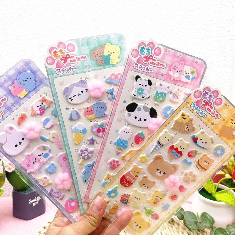 【ぷっくり可愛い3D肉球シール6枚セット 】ぷくっと立体的な形が可愛い、人気の肉球3Dステッカー。ふわふわ触感の発泡素材を使用し、見た目も触り心地も癒されるデザイン。猫の手うさぎクマアイスクリーム寿司など可愛いキャラクターが揃い、貼るだけで気分が上がるアイテムです。【プニプニ触感でストレス解消＆癒しアイテムに】柔らかいシリコン風のプニプニ素材で、思わず触りたくなる弾力感。触覚刺激によりリラックス効果があり、子供から大人までストレス解消グッズとしても大人気。デスクの癒しアイテムとしてもおすすめです。【強力粘着で貼り直しOK跡が残りにくい】裏面には高品質粘着剤を採用し、スマホケース手帳タブレット透明ケースなどの平面にしっかりフィット。剥がしても跡が残りにくく、貼り替えも簡単。耐久性にも優れており、長く使える安心仕様です。【DIYデコレーションに最適なデザインステッカー 】手帳ノートアルバムスマホケーススクラップブック水筒などのデコレーションにぴったり。肉球やキャラクターを組み合わせて、自分だけのオリジナルアレンジが楽しめます。ごほうびシールとしても大活躍。【プレゼントや子供のごほうびにも喜ばれる可愛いステッカー】かわいい動物モチーフのぷくぷくシールは、女の子へのプレゼント、子供のごほうび、友達へのプチギフトにも最適。見た目の可愛さと触り心地の楽しさで、贈り物としても喜ばれる人気アイテムです。ぷくっと膨らんだ立体感がとても可愛い「ぷにぷに肉球シール 6枚セット」。柔らかい発泡素材で作られた3D立体ステッカーは、思わず触りたくなるプニプニの肉球デザインが特徴です。猫の手、うさぎ、クマ、アイスクリーム、寿司など、多彩なキャラクターを組み合わせた可愛いセットで、手帳ノートスマホケースといった身近なアイテムを簡単にデコレーションできます。シリコン風の弾力ある素材は、プニプニとした触感が心地よく、触るたびに癒されるストレス解消グッズとしても人気。子供から大人まで楽しめる触感ステッカーです。裏面には高品質粘着を採用しており、滑らかな面にしっかり貼れるうえ、剥がしても跡が残りにくく、貼り替えも簡単。耐久性にも優れているので長期間使えます。DIYやデコレーション好きの方にもぴったり。スクラップブック、アルバム、水筒、タブレットケースなど、さまざまなアイテムに貼るだけでオリジナリティを楽しめます。子供のごほうびシールとしても大活躍し、女の子へのプレゼントやプチギフトにもぴったりです。かわいさ、立体感、プニプニ触感を同時に楽しめる肉球3Dステッカー。癒しとデコレーションを兼ね備えた、持っているだけで気分が上がるおすすめアイテムです。