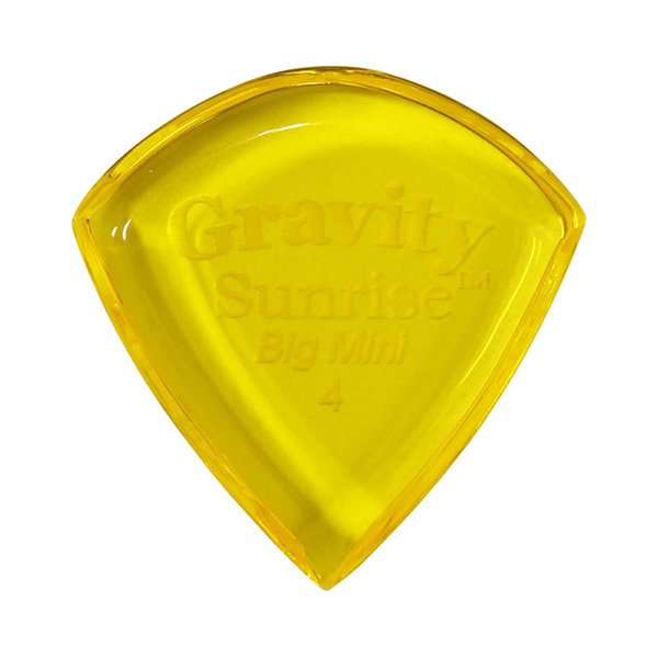 グラヴィティ ギター ピック　Sunrise - Big Mini 形状：Sunrise - Big Mini 厚さ：4.0mm, Yellow 材質：アクリル 販売単位：1枚グラビティギターピックは、ハンドメイドでピックを製作するアメリカのブランド。アクリル素材を職人の手によりひとつひとつ丁寧に加工され作られるピックは、美しく磨き上げられ、手に馴染む使い心地と、スムースな演奏性、すばらしいトーンを生み出します。 アクリルを使用し独特のエッジデザインを採用する事で、速くラウドなプレイにも対応。一般的なピックに比べ耐久性も高く、同じトーン、同じ演奏性で長期間使用できるのも特徴です。 その他のGRAVITYピックを探す