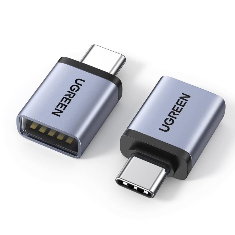 UGREEN USB Type C 変換アダプター USB3.2 Gen1 高速転送 OTG対応 2個セット 変換コネクタ シルバー従来のUSBから最新規格でありながら、小型化であるUSB Type C 変換アダプターです。小型化、軽量化を実現し、Macbookなどの機器に二つ並べて挿し込んでも干渉せず使用できます。ミニマリスト且つ上品なデザインはデジタル製品によく似合っています。データ転送と急速充電：USB3.2 Gen1に準拠してUSB2.0より10倍の、最大5GBit/sまで上がっています。動画や映画、音楽などを数秒で高速転送することができます。下位互換性があるため、USB3.0とUSB2.0機器にも対応できるし、タイプC USB変換アダプターは最大9V/2AのUSB-Aポートを備えたデバイスの充電もサポートします。OTG機能搭載：外付けHDD、USBメモリ、マウス、キーボード、ゲームコントロール、カードリーダー、プリンター、カメラなどのUSB機器をUSB Type-C端子のスマホやタブレットに接続可能です。手元のUSB機器を最大で活用できます。幅広い対応機種：ノートPCやタブレット端末、スマートフォン等の幅広いUSB-C機器に対応し、お使いの機器でUSB-A周辺機器が利用可能です。このUSB-C変換アダプタはiPhone 15 Pro Max、MacBook Pro/Air 2022、iPad Pro 2021/2020、Galaxy S22/S21/S20 などのType C/Thunderbolt 3対応するラップトップ/タブレット/OTGスマートフォンと互換性があります。プレミアムデザイン：コネクタ部分とスペースグレイのアルミニウム素材の本体部分が一体のデザインを採用しており、高いデザイン性と優れた耐久性を実現しました。 56KΩ抵抗の実装で充電とデータ転送の安全と持久を確保できるし、デバイスを短絡、過充電、過熱などからしっかり守れます。コネクタ部にメッキ加工を施した端子もデバイスにピッタリ嵌り、脱着耐久性も抜群です。24ヶ月の期間：当店でご購入の製品は24ヶ月間のサービスをご提供しております。お客様が製品を購入された時点から24ヶ月後の応当日までいたします。 ご注意：お客様または第三者による故意の破損が認められる場合は、の対象外となります。複数店舗にて販売をしておりますため、在庫データの更新が間に合わず、欠品にも関わらず、注文ができる場合がございます。その際は、キャンセルにて対応を取らせていただきます。当店はお電話のお問い合わせはお受けしておりませんので、ご了承ください。お問い合わせは、問い合わせフォームをご利用ください。