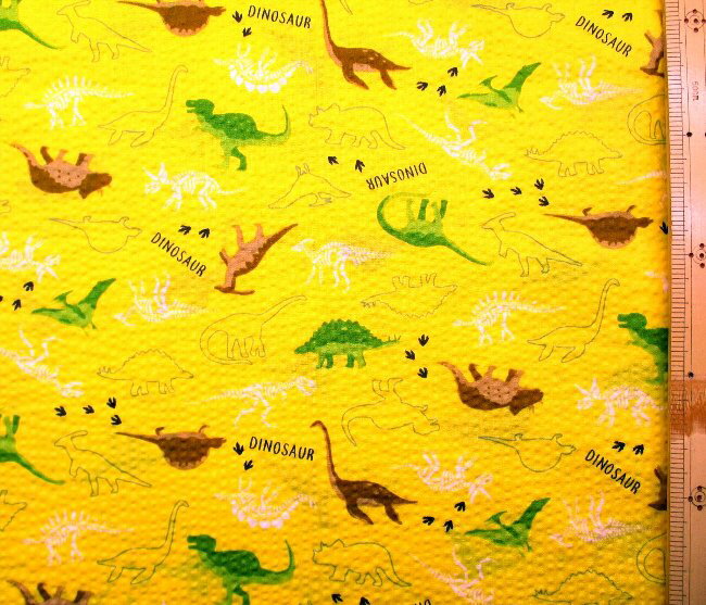 リップル生地 （ サッカー生地 ) 恐竜の足跡 （ イエロー 系 ) 生地幅－約108cm（ 綿100％ ） （ リップル 布 浴衣 ゆかた 甚平 ジンベイ じんべえ パジャマ 夏素材 ベビー あしあと ダイナソー 白 ラブリー )