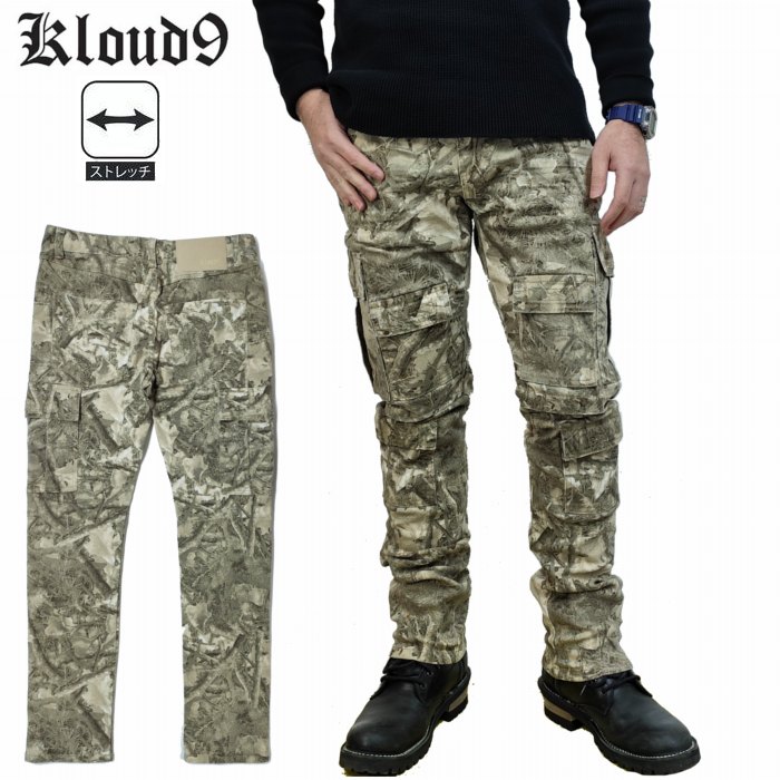 ■スタイル■ 迷彩 スリムフィット カーゴパンツ ユーズド加工 ストレッチ 953444 ■ブランド■ kloud9 クラウドナイン メンズ ストリートウェア 大人も穿きやすい加工パンツ ■コメント■ Kloud9は2017年にスタートしたストリートウェアブランドです。 草や葉っぱの迷彩でポケットが沢山付いたカーゴパンツ。 太ももや膝下にも大小のポケットが付いたストレッチの素材のカーゴパンツ。 ボタンやリベット、腰元のパッチなどオリジナルの仕様で、フロントはYKKファスナーになります。 加工物ですので糸飛びや汚れの様に見える箇所もありますが商品の味としてお楽しみ下さい。 ■素材■ コットン98％　 ポリウレタン2％ ■サイズスペック■ サイズ/ウエスト/ワタリ幅/裾幅/股上/股下 32インチ/86/29/17/26/80 34インチ/88/30.5/17.5/26.5/81 【必ずご確認下さい】 ※ 画像はデジカメで撮影しています。ブラウン管や 液晶など見られる環境によって色目が異なって見えます ことをご了承ください。 ※ 製品誤差として2cm程度、表記サイズより異なる場合が御座います。 おおよその目安とお考え下さい。草や葉っぱの迷彩でポケットが沢山付いたカーゴパンツ。