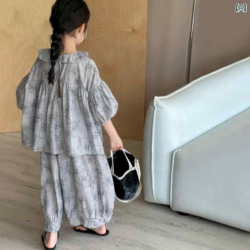 ・カテゴリ: 子供向けセットアップ・対象性別: 女の子・スタイル: 韓国風・セット内容: 2点セット・袖丈: 半袖・パンツ丈: 九分丈・生地加工: 柔軟加工・生地の厚さ: 薄手・柄: 無地・デザイン要素: セットアップ、田園風、可愛い、プリンセス風、トレンド・主な素材: レーヨン100%・安全基準: B類・着用方式: プルオーバー・カラー展開: ライトグレー・対応身長: 110cm、120cm、130cm、140cm、150cm、160cm