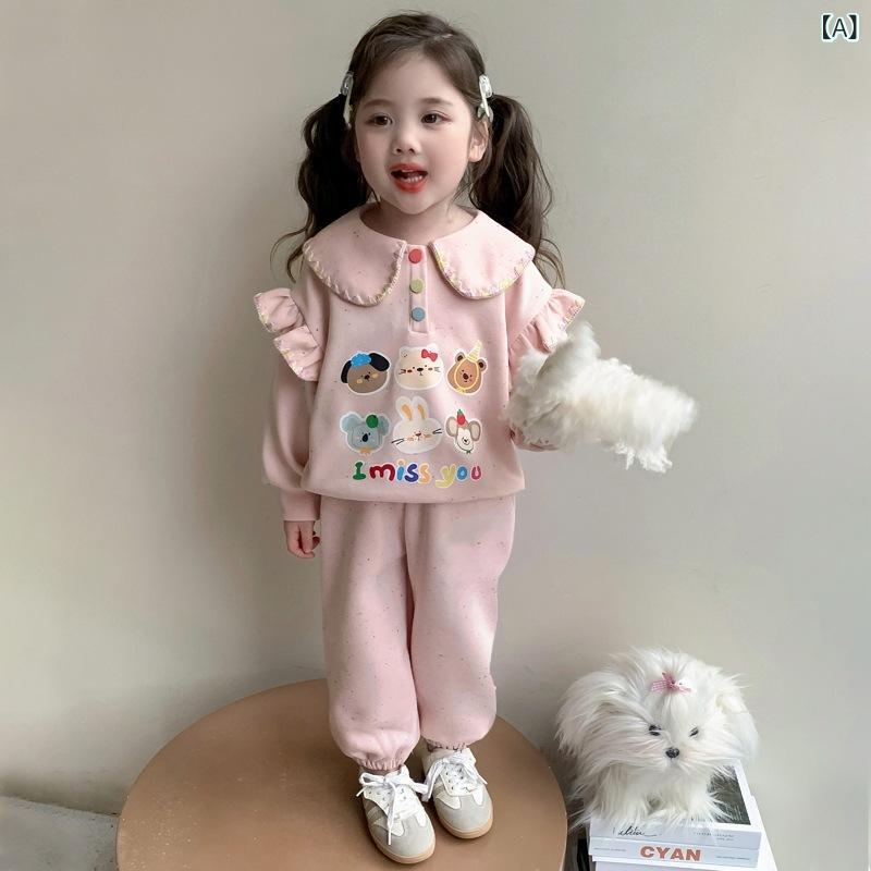・カテゴリ: 子供用セットアップ・対象性別: 女性・スタイル: 韓国風・セット内容: パンツセット、2点セット、衣類・対象年齢: 中小童（3〜8歳、100〜140cm）・袖丈: 長袖・フード: フードなし・パンツ丈: ロングパンツ・生地加工: 柔軟処理・厚み: 普通・柄: キャラクター・デザイン要素: スポーツ、セットアップ、キャラクター、レース・生地名称: ニット生地・主な素材: 綿65%・安全基準: B類・留め具の種類: プルオーバー・カラー展開: ピンク、グリーン・展開サイズ: 90cm、100cm、110cm、120cm、130cm、140cm