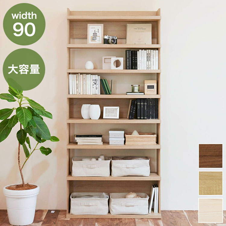 商品説明文壁面を圧倒的な収納空間に変える、2m級オープンラック。高さ約200cm・幅70cmのオープンラック「トルフラット」。厚みのある棚板と洗練されたナチュラルな木目が、造り付け家具のような大容量収納を演出します。リビングや書斎、本棚・ディスプレイラックとしても最適です。こだわりのデザイン×上質な存在感・厚い棚板デザイン前面にせり出した厚めの棚板が力強い存在感を放ち、ディスプレイ性と収納力を両立。空間のアクセントとしても映えます。・すっきり見えるオープン構造開放感のあるオープンラック設計で、圧迫感なく壁面を有効活用できます。高さ2mの大容量・可動棚で自由なレイアウト・可動棚5枚（3cmピッチ調整）棚板は3cmピッチで高さ調整でき、書籍・ボックス・インテリア小物など用途に合わせて使い分けできます。・耐荷重10kg（各棚／天板）各棚・天板とも耐荷重10kg（目安）で、本・雑貨・AV機器まで置けます。・巾木よけ・免震補助バンド付属壁にぴったり設置できる巾木よけ加工と、安心の免震補助バンド付き。地震時の前倒れ対策にも配慮されています。商品仕様（概要）サイズ：幅90.0×奥行29.0×高さ200.0（cm）素材：プリント紙化粧繊維板（F☆☆相当）可動棚：5枚（高さ調整可能／3cmピッチ）耐荷重：天板・棚板各約10kg（目安）付属品：免震補助バンド【送料について】北海道、沖縄、離島は送料を頂きます。オープンラック 高さ200cm幅50cm幅70cm幅90cm