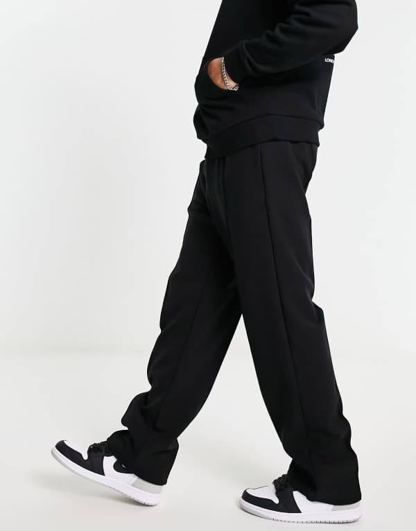【送料無料】 ウィークデイ メンズ カジュアルパンツ スウェットパンツ ボトムス Weekday ken straight leg sweatpants in black Black