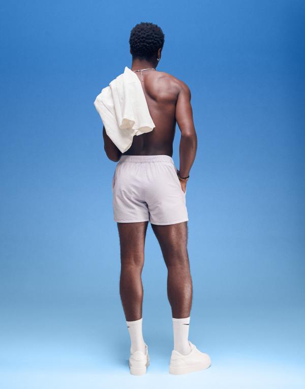 【送料無料】 エイソス メンズ ハーフパンツ・ショーツ 水着 ASOS DESIGN seersucker swim shorts in short length in purple PURPLE